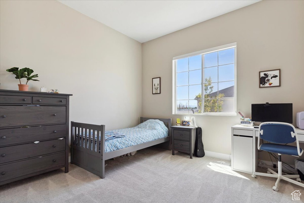 Carpeted bedroom with baseboards