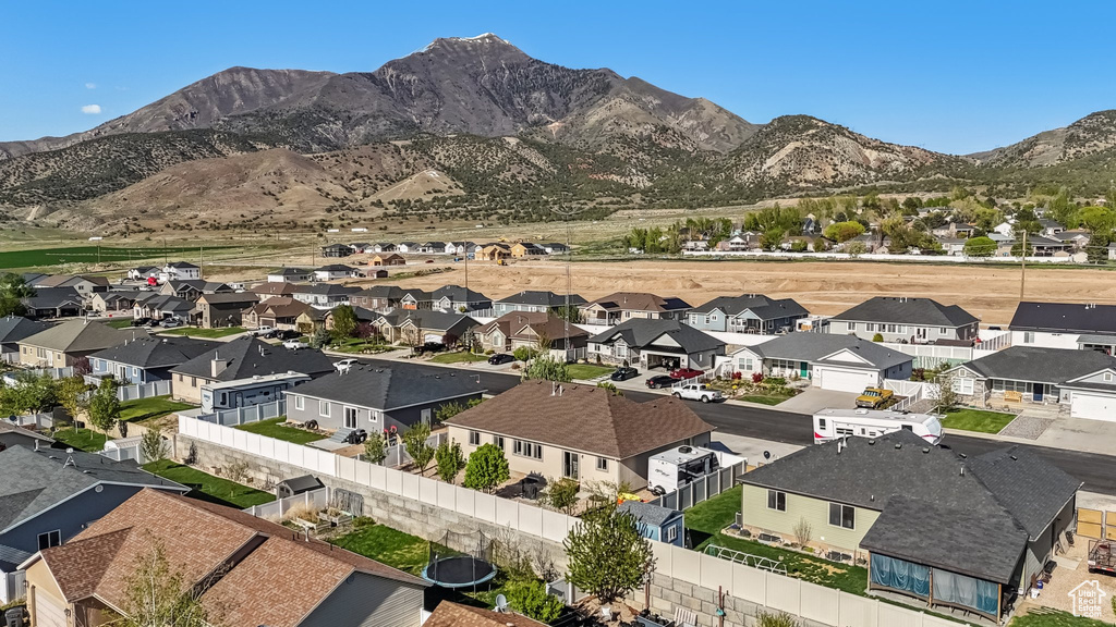 Birds eye view of property featuring a mountain view and a residential view