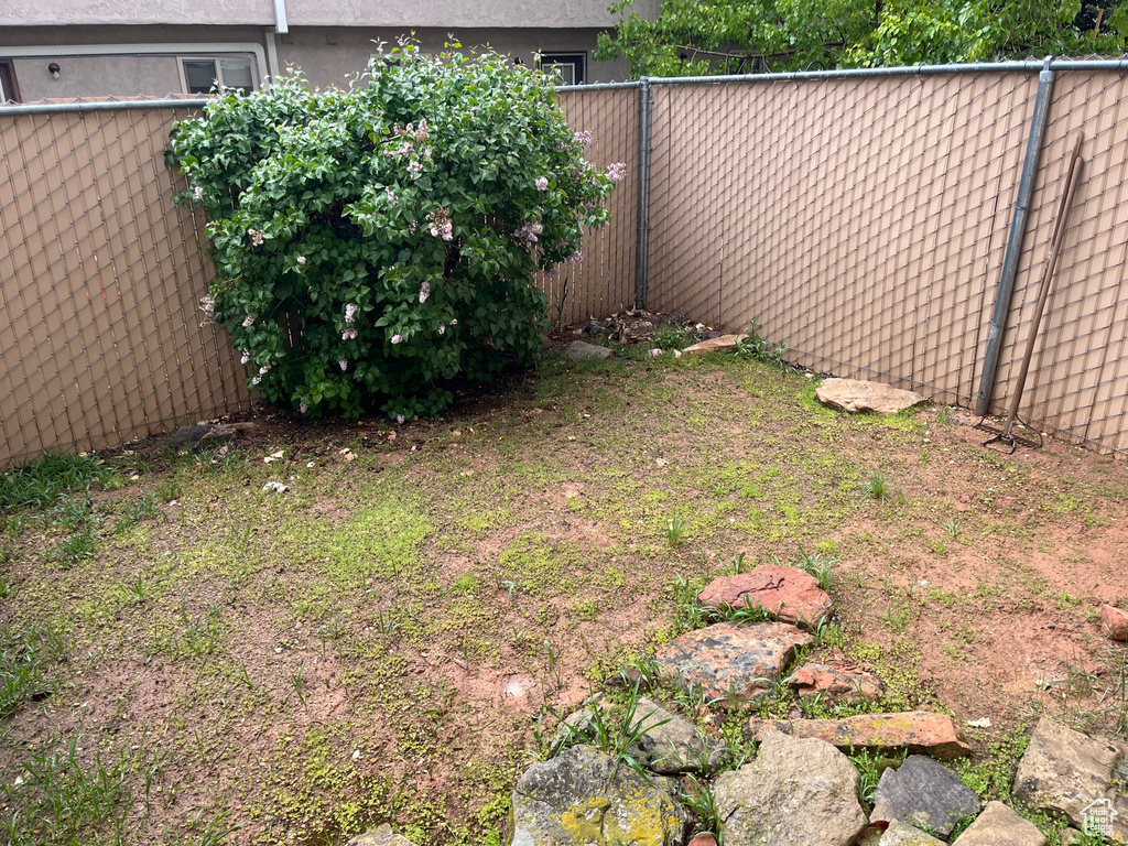 View of yard featuring fence