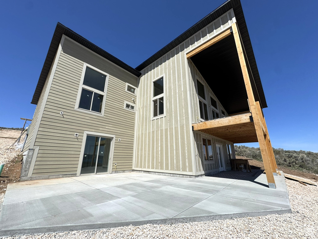 Back of house with a patio area
