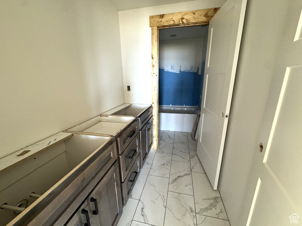 Bathroom featuring marble finish floor