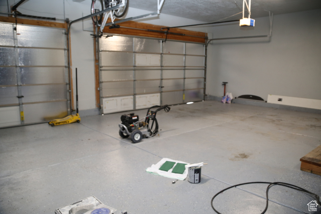 Garage featuring a garage door opener