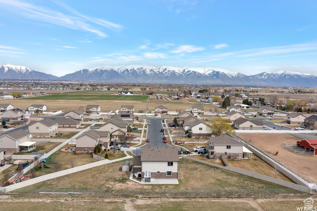 Aerial view of residential area with a mountain backdrop