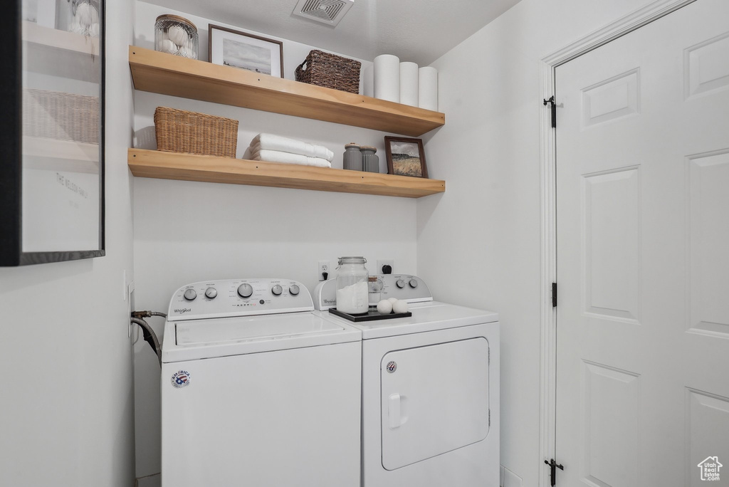 Washroom featuring washer and clothes dryer