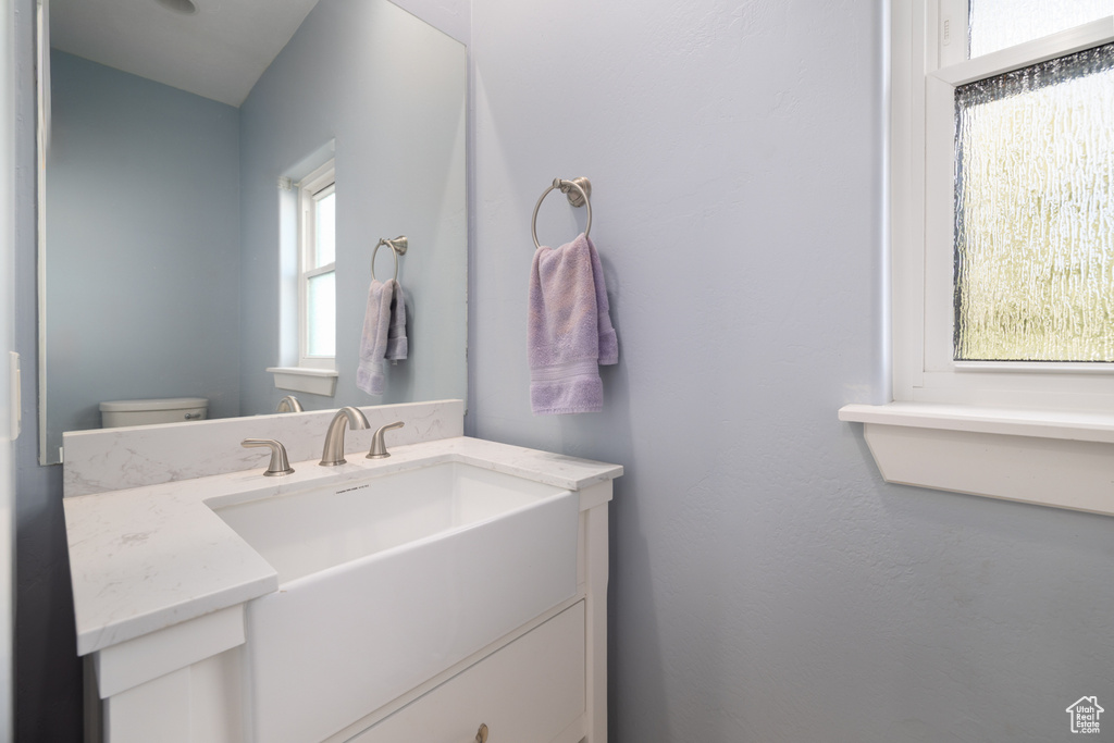Bathroom featuring toilet and vanity
