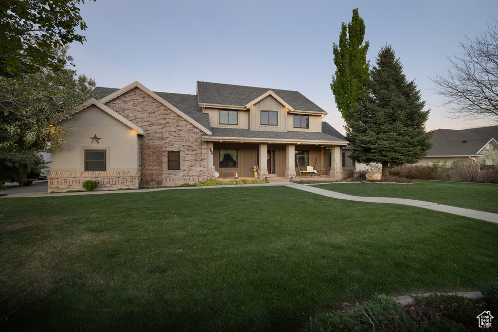 Craftsman house with a porch and a front lawn