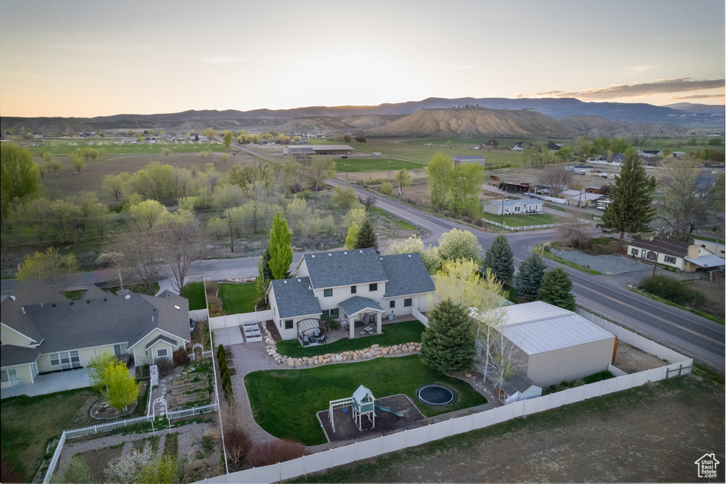 Aerial view at dusk featuring a mountain view