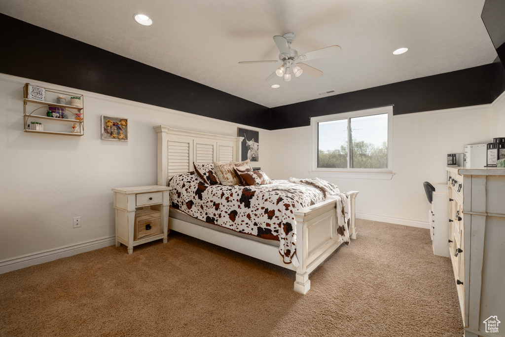 Carpeted bedroom with recessed lighting and baseboards