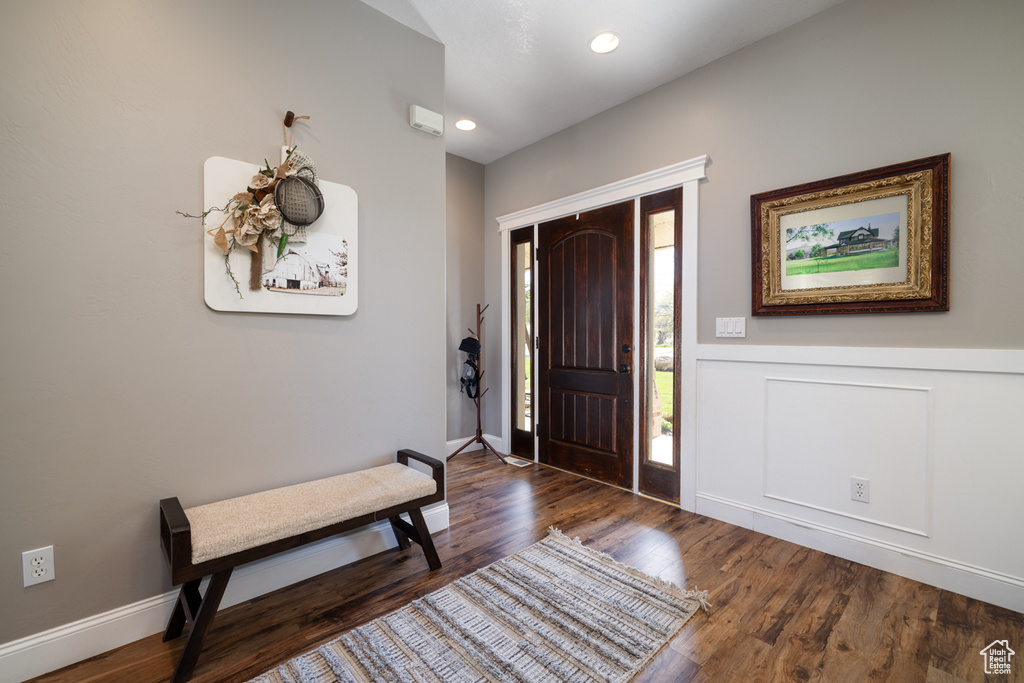 Foyer entrance featuring a wainscoted wall, recessed lighting, and wood finished floors