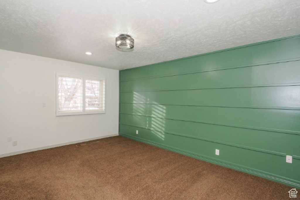 Unfurnished room featuring carpet flooring, recessed lighting, a textured ceiling, and baseboards