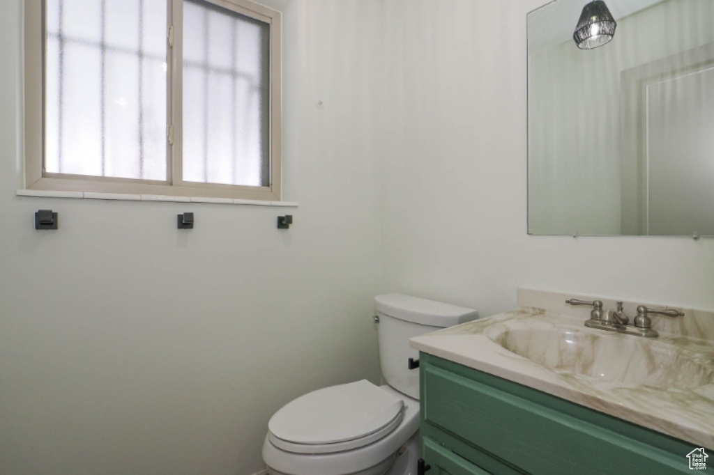 Bathroom with vanity and toilet