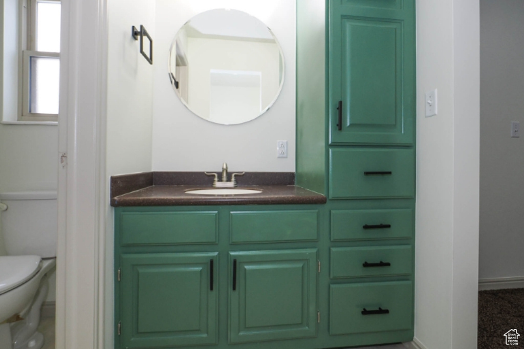 Bathroom with vanity and toilet