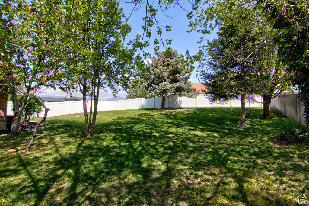 View of yard with a fenced backyard