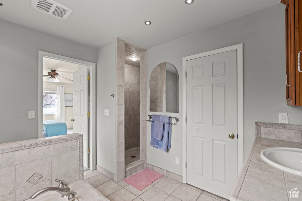 Bathroom with visible vents, ensuite bathroom, a walk in shower, tile patterned floors, and a ceiling fan