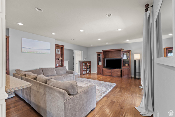 Living room featuring recessed lighting and wood finished floors