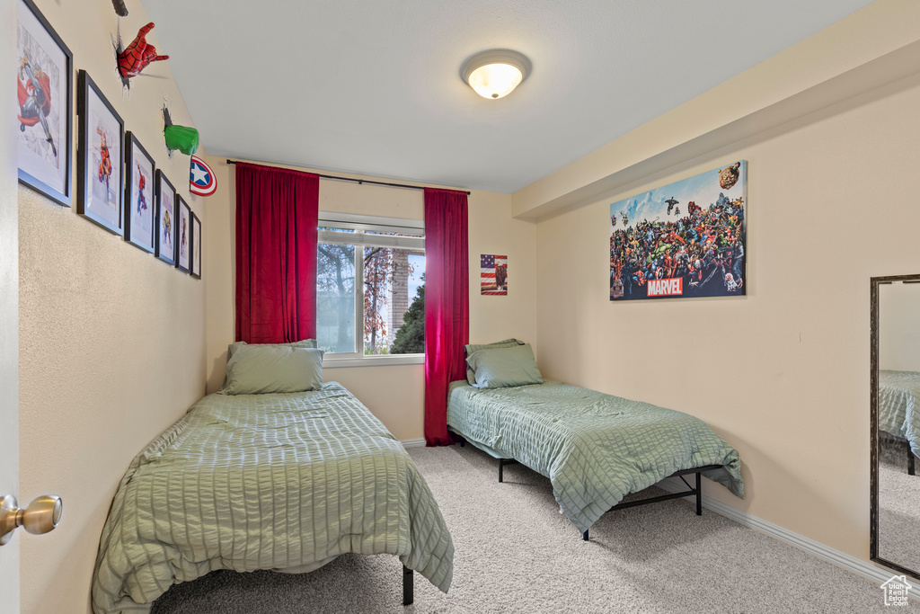 Carpeted bedroom with baseboards