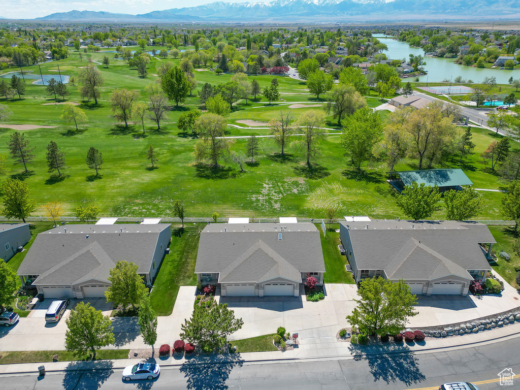 Bird's eye view with a water and mountain view, golf course view, and a residential view