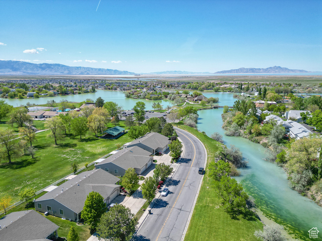 Birds eye view of property with a residential view and a water and mountain view