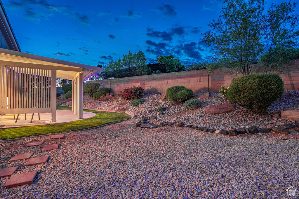 View of yard featuring a fenced backyard and a patio area