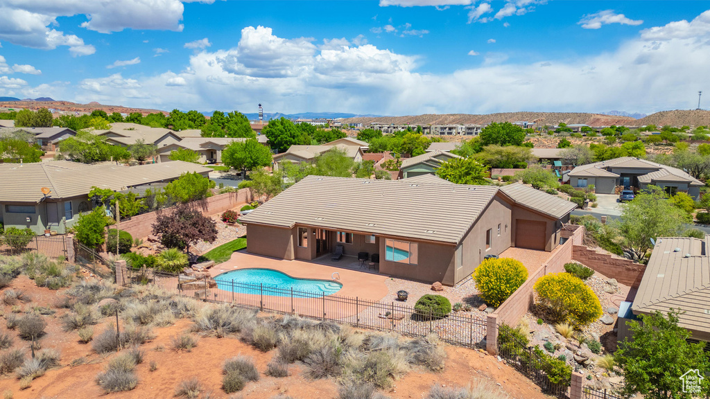Birds eye view of property with a mountain view and a residential view