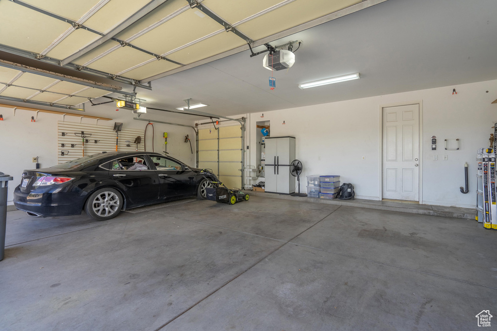 Garage featuring a garage door opener