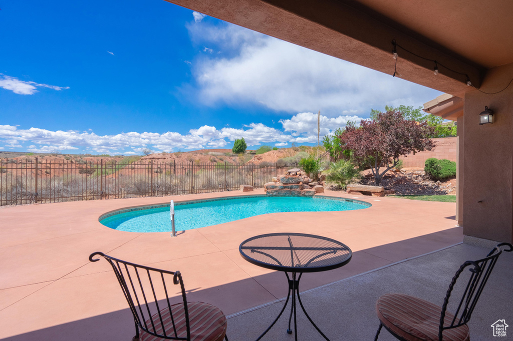 View of pool with a fenced backyard, a fenced in pool, and a patio area