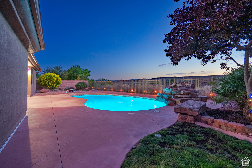 View of pool with a fenced in pool, a fenced backyard, and a patio area
