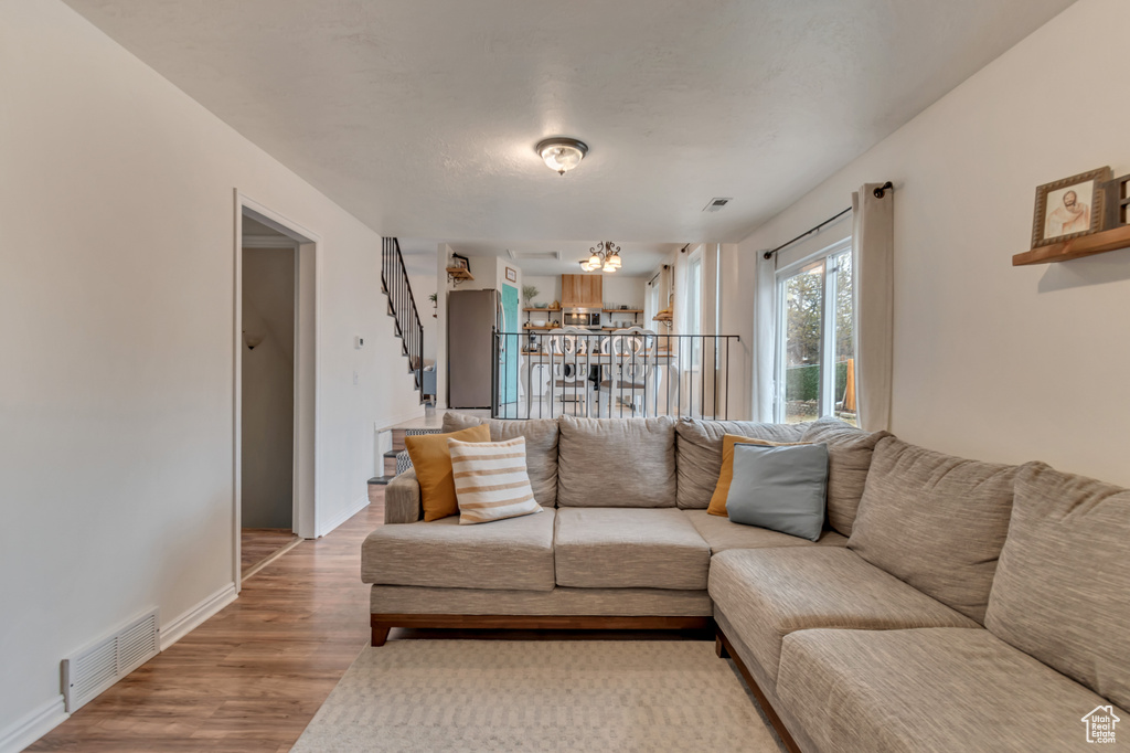 Living room with hardwood / wood-style flooring
