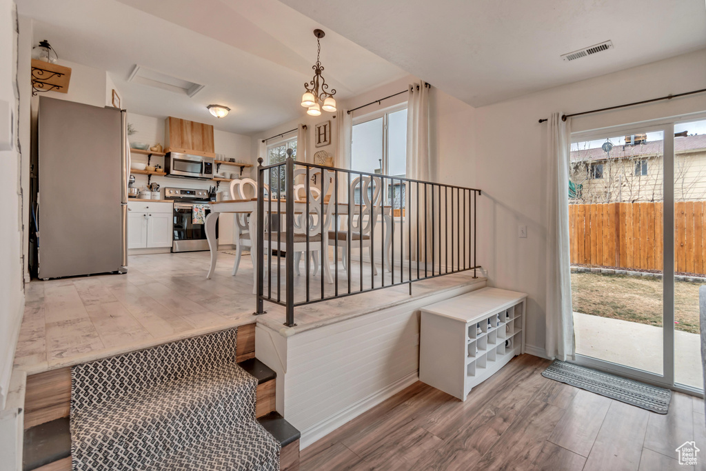Stairway featuring wood-type flooring