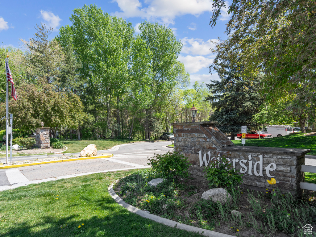 Community / neighborhood sign with a yard