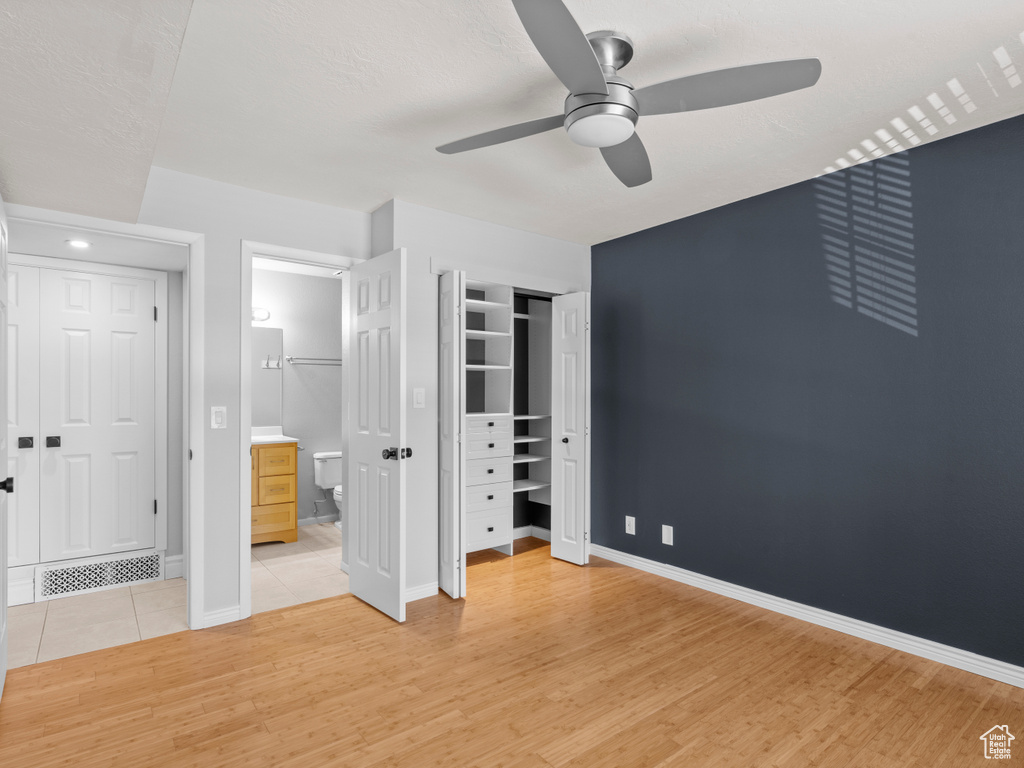 Unfurnished bedroom featuring baseboards, visible vents, and light wood-style floors