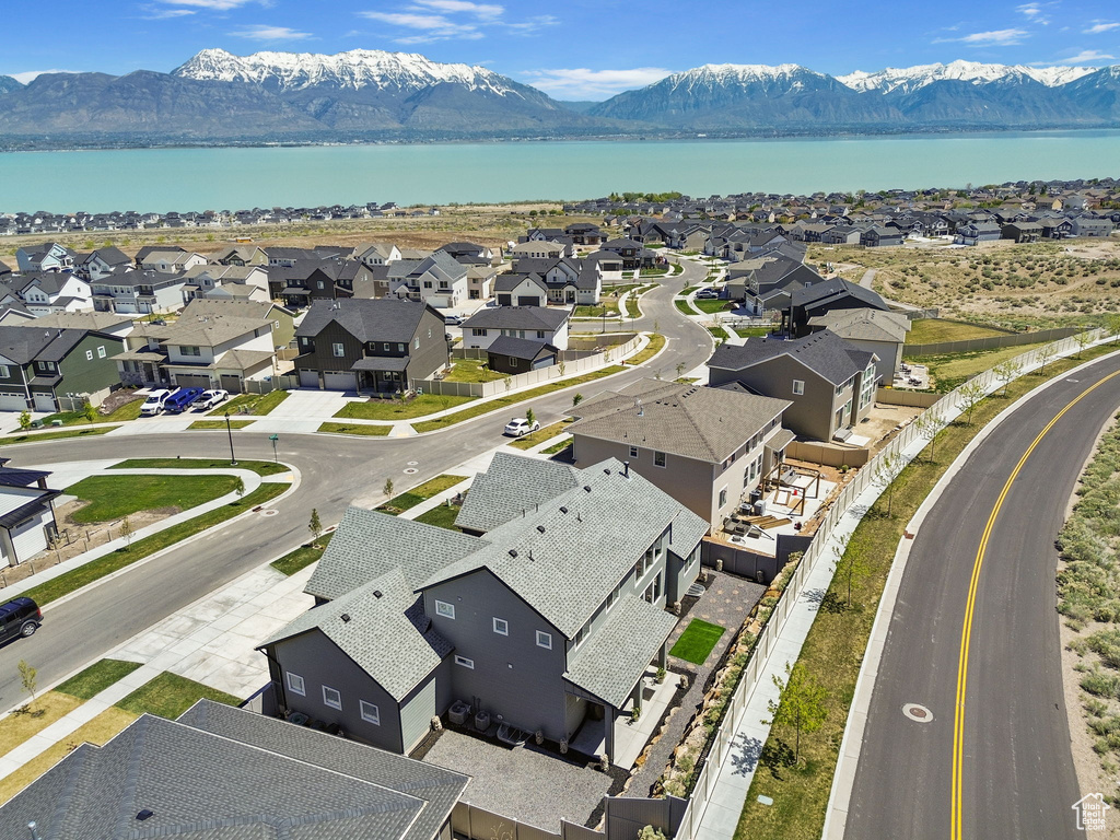 Drone / aerial view with a residential view and a water and mountain view
