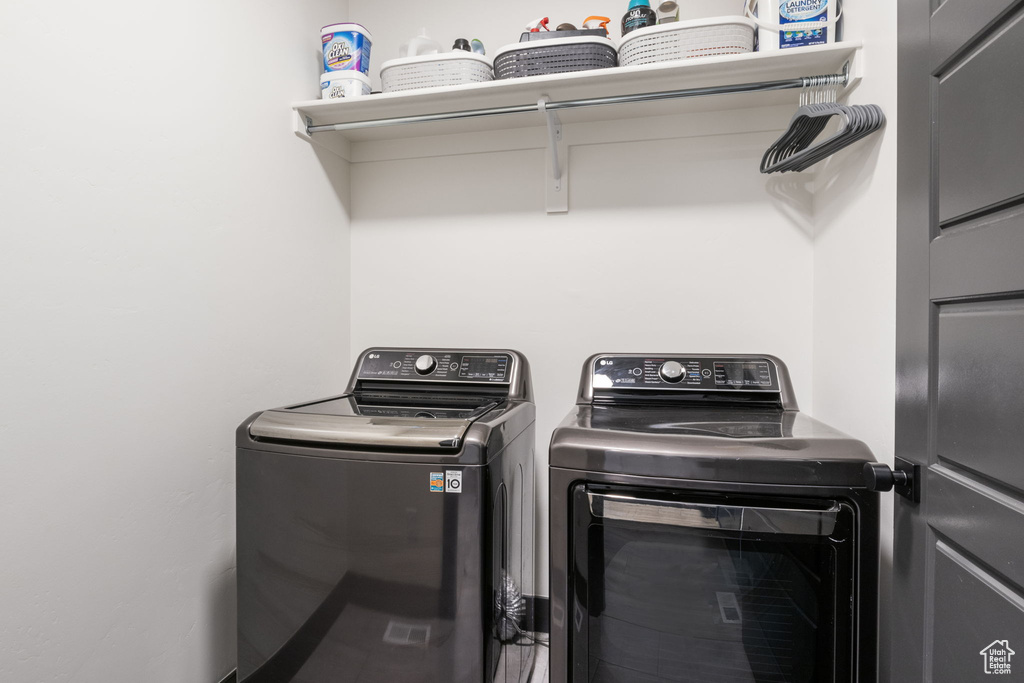 Laundry area featuring laundry area and washer and clothes dryer