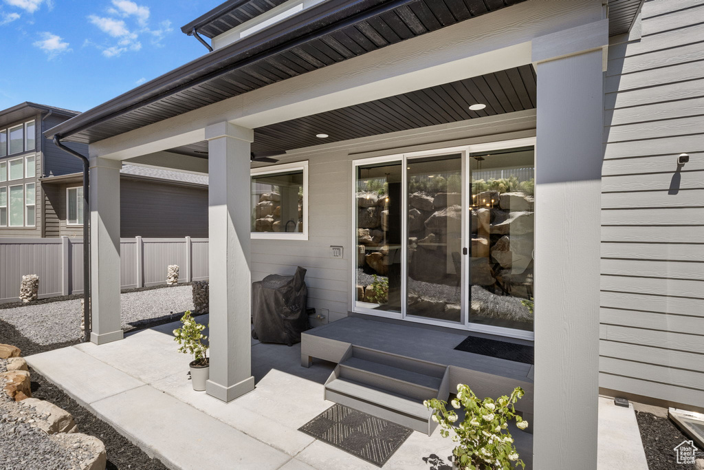 View of patio featuring fence