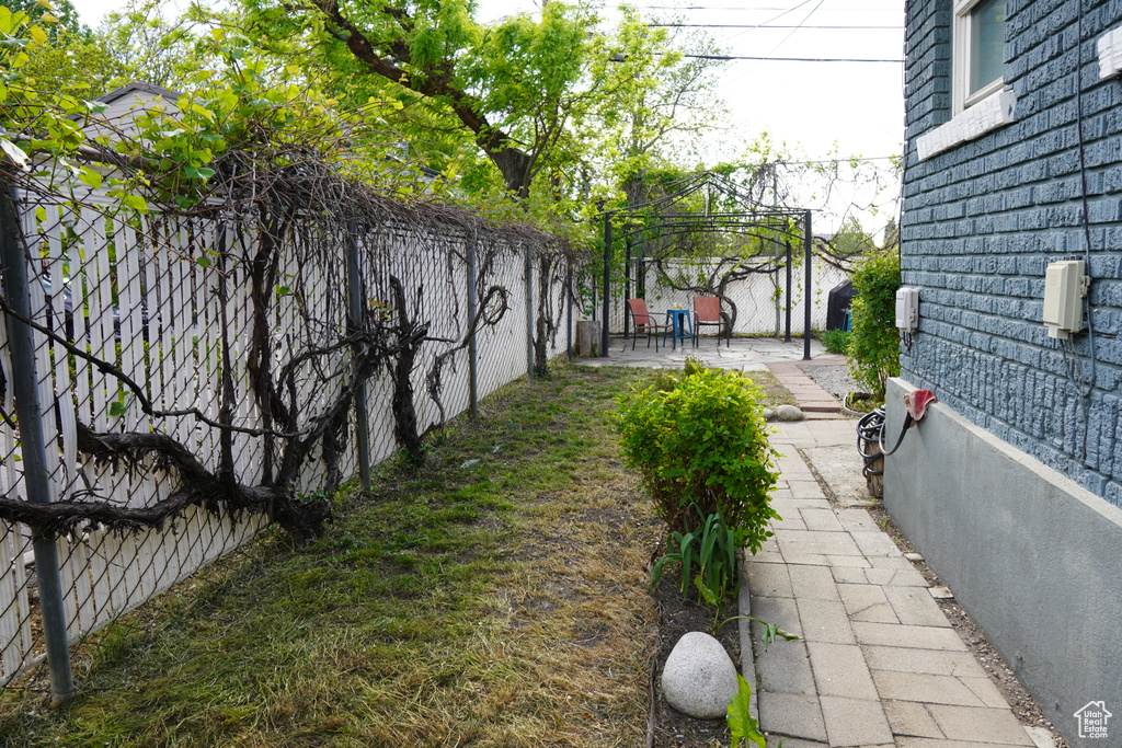 View of yard with a gazebo, a fenced backyard, and a patio area