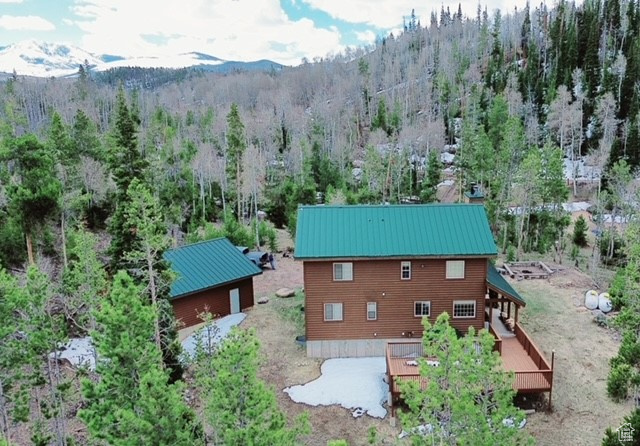 Drone / aerial view with a wooded view