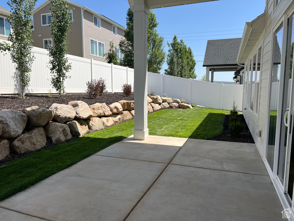 Fenced backyard featuring a patio area