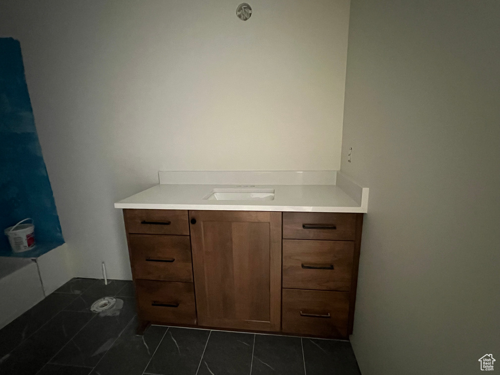 Bathroom featuring vanity and tile patterned floors