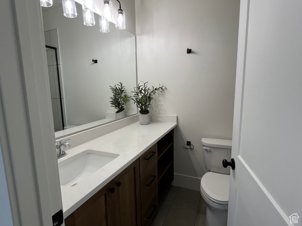 Bathroom featuring tile patterned floors and vanity