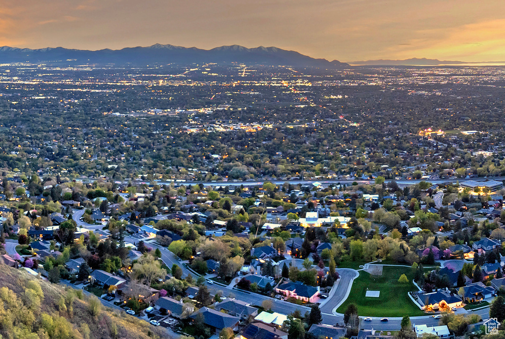 Aerial view at dusk featuring a mountain view