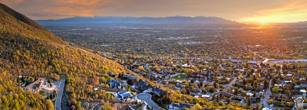 Aerial view at dusk featuring a mountain view