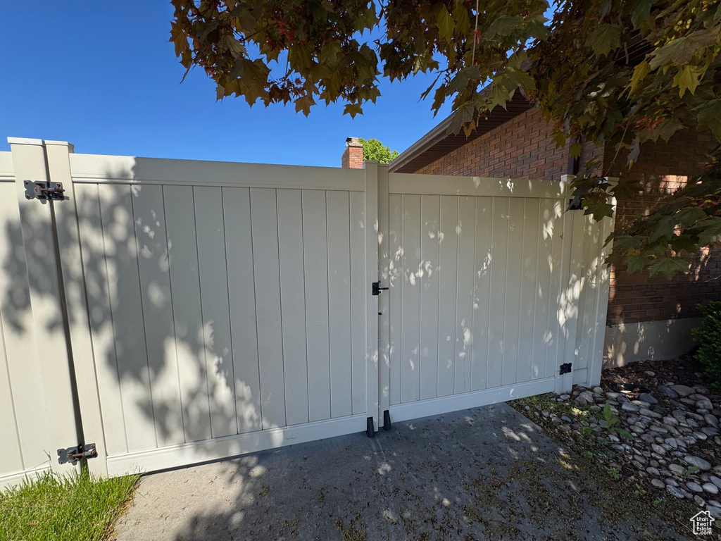 View of gate featuring fence
