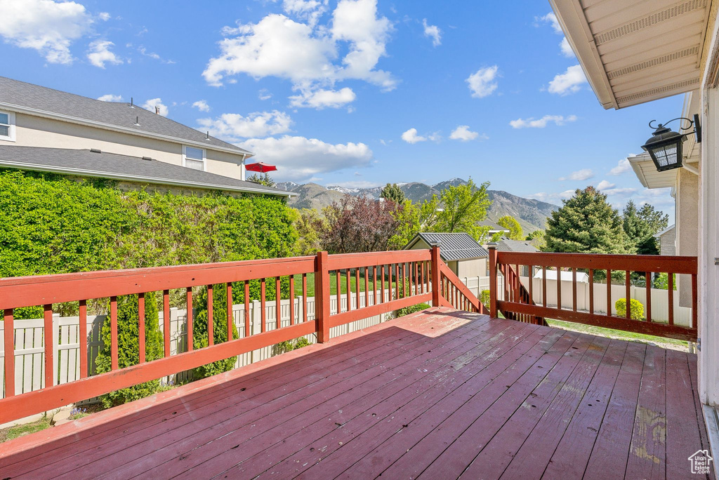 Wooden terrace featuring a mountain view
