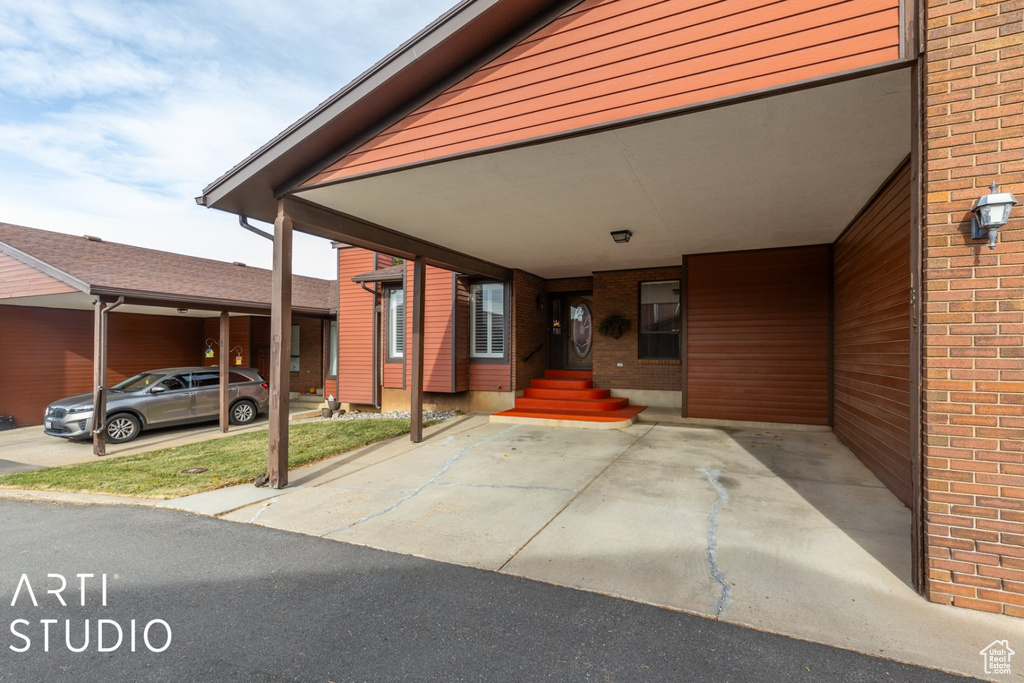 Exterior space with an attached carport