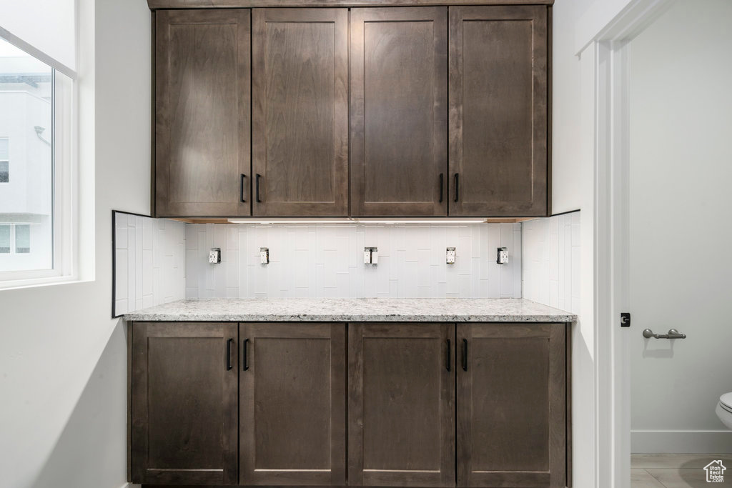 Bar with backsplash and baseboards