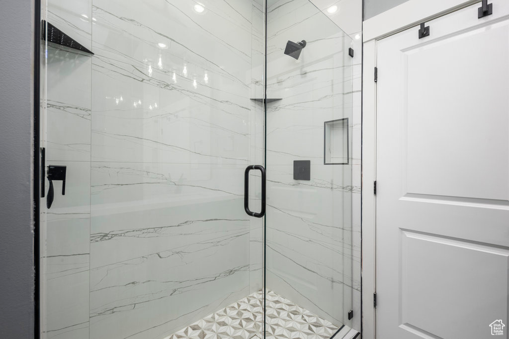 Bathroom with a marble finish shower