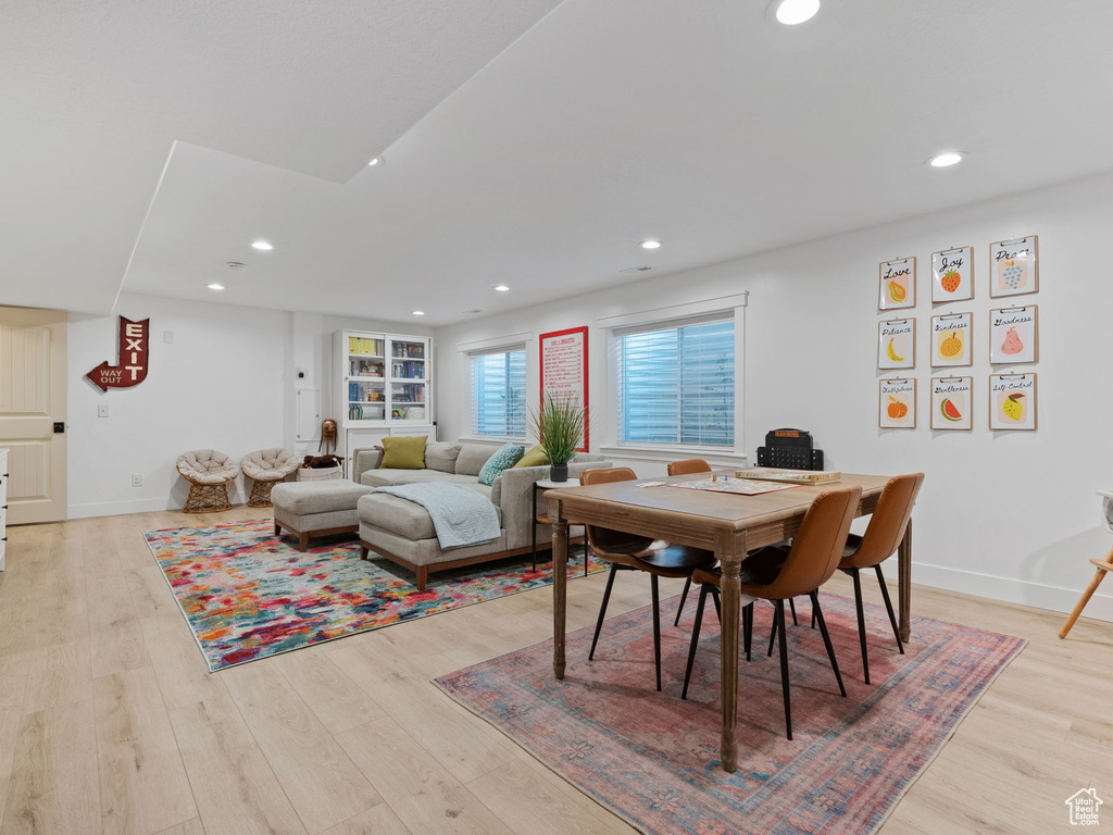Dining area featuring baseboards, recessed lighting, and light wood-style flooring