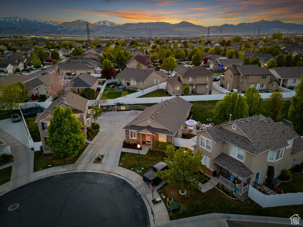 Aerial view at dusk with a residential view and a mountain view