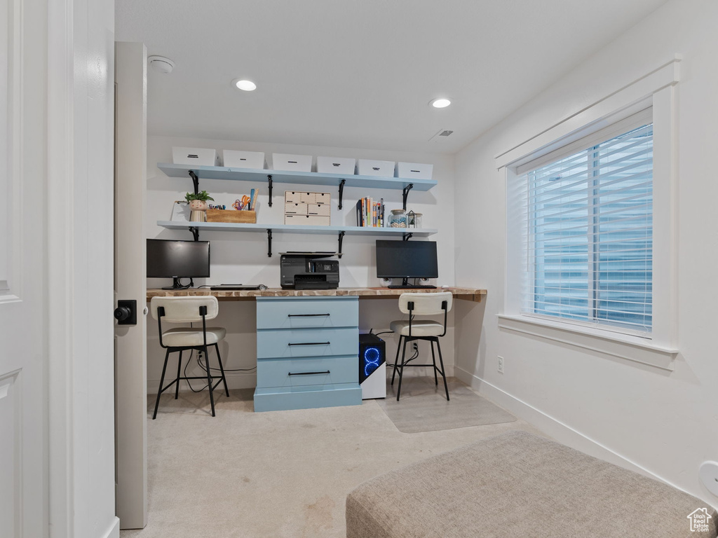 Home office with recessed lighting, baseboards, and light colored carpet