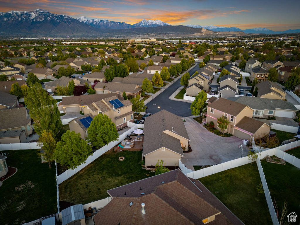 Aerial view at dusk with a residential view and a mountain view
